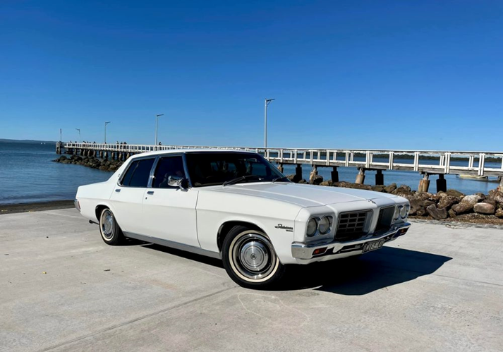 The white whale de Ville soaking up the sunshine.